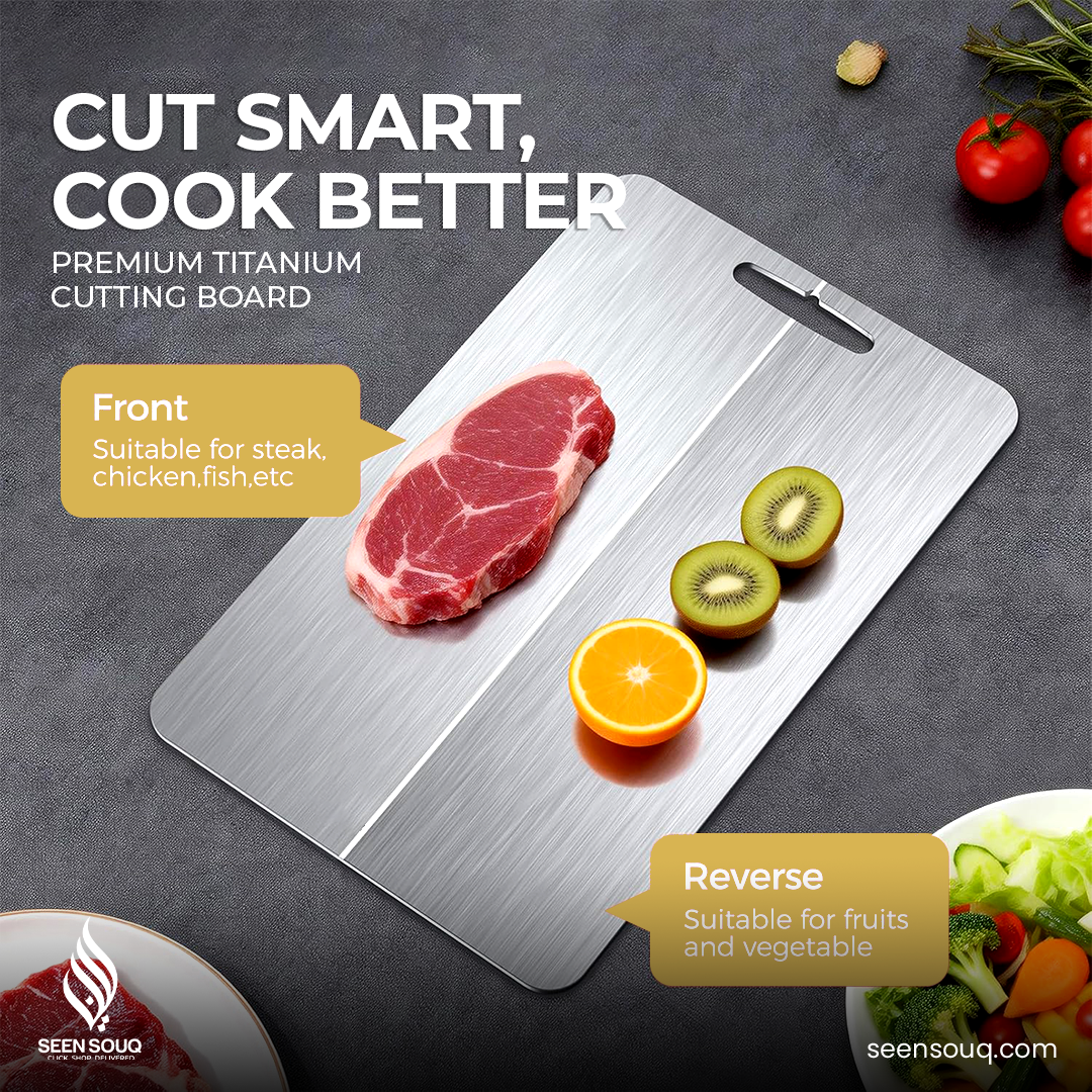 Premium titanium cutting board with steak on one side and fruits on the other, displayed on a dark surface.